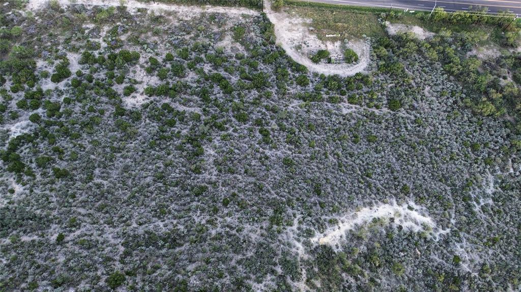 925 Highway 83 Junction, TX 76849 - Photo 4 of 27 a aerial view of a house with a yard and large trees