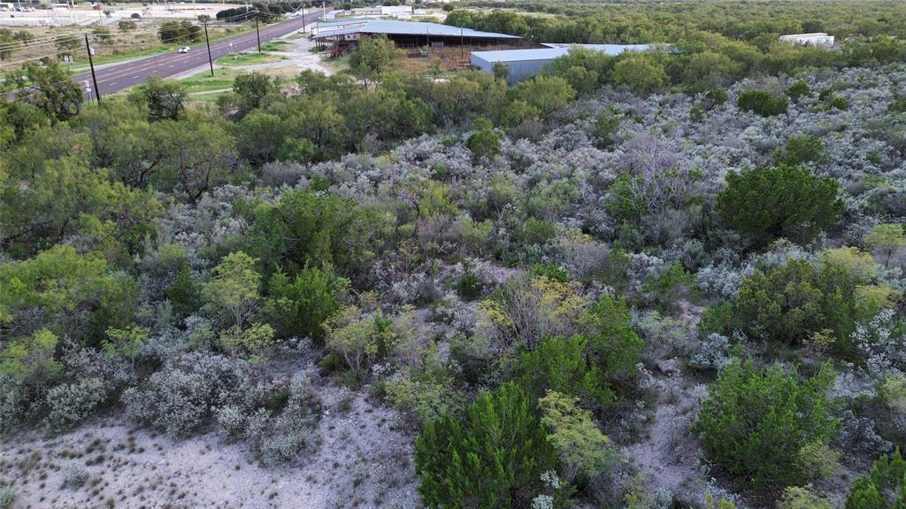 925 Highway 83 Junction, TX 76849 - Photo 7 of 27 an aerial view of residential house with outdoor space and trees all around