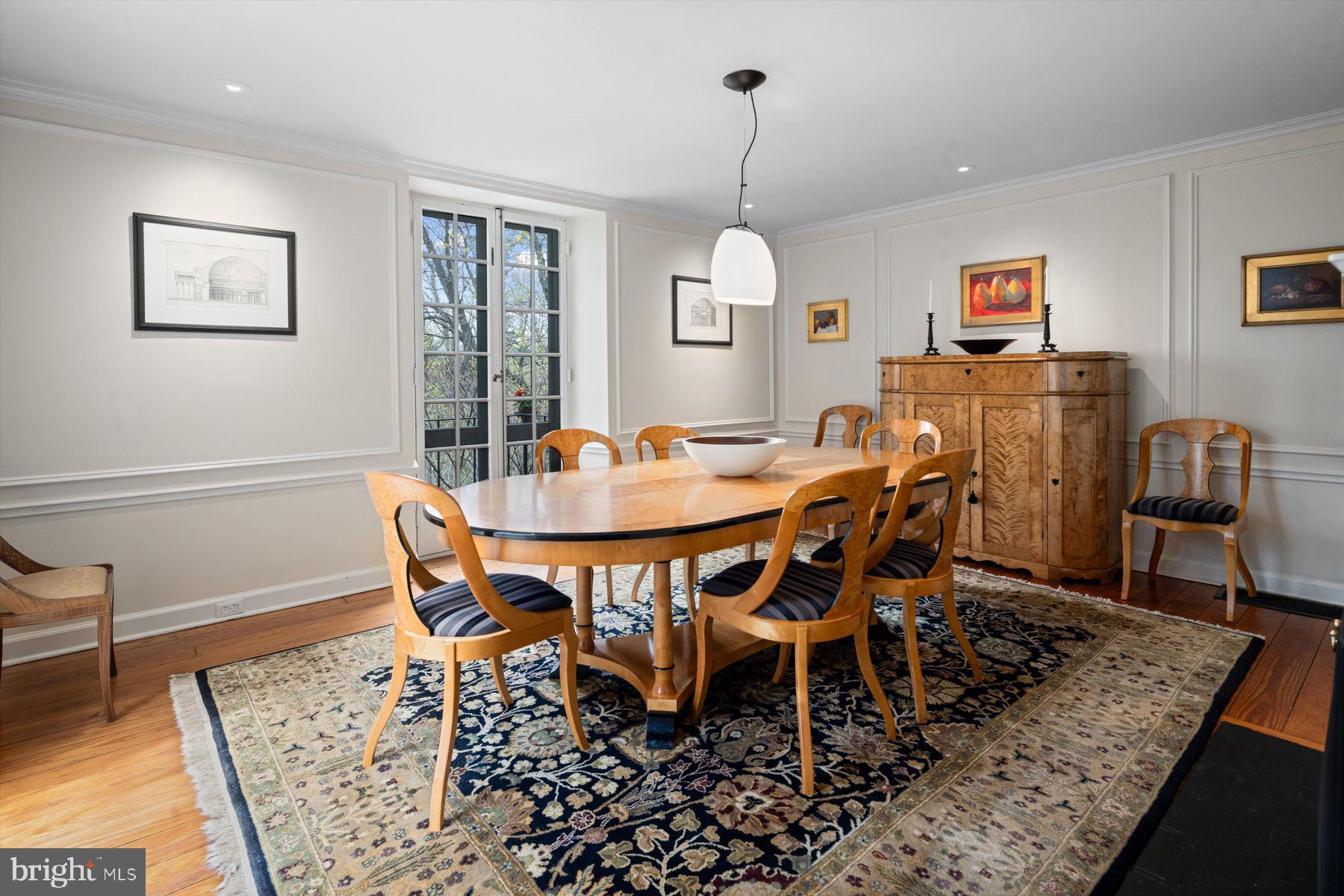 95 West Hampton Road Philadelphia, PA 19118 - Photo 13 of 37 a view of a dining room and livingroom with furniture wooden floor a rug a painting and a chandelier