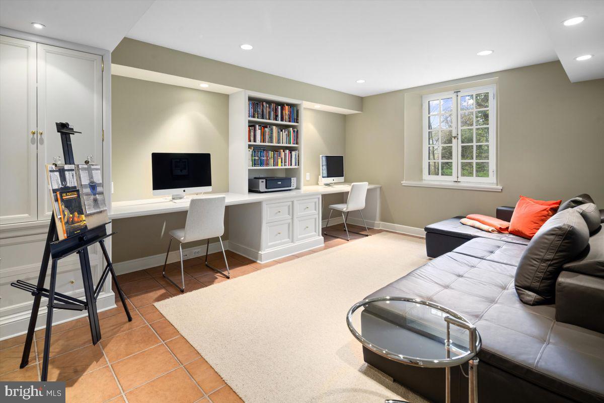 95 West Hampton Road Philadelphia, PA 19118 - Photo 18 of 37 a living room with furniture a flat screen tv and a window