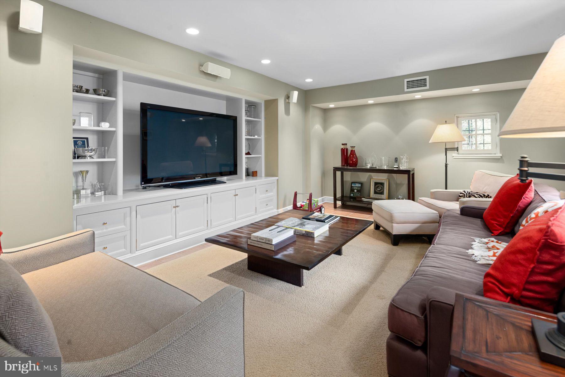 95 West Hampton Road Philadelphia, PA 19118 - Photo 20 of 37 a living room with furniture and a flat screen tv
