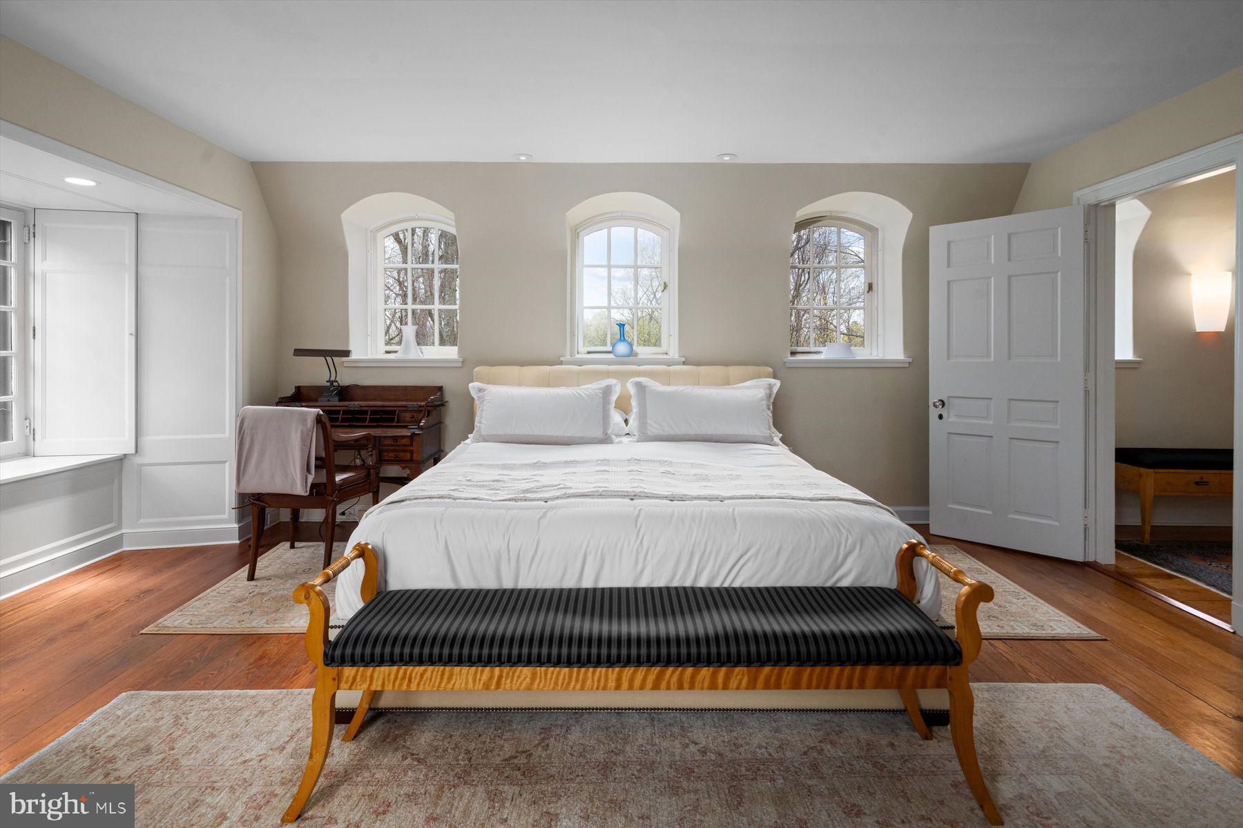 95 West Hampton Road Philadelphia, PA 19118 - Photo 23 of 37 a bedroom with a bed a mirror and a table