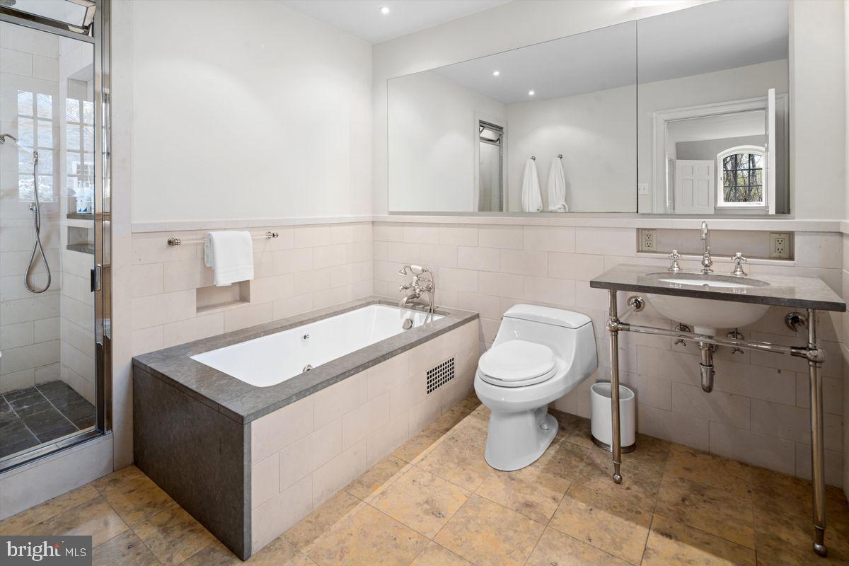 95 West Hampton Road Philadelphia, PA 19118 - Photo 25 of 37 a bathroom with a toilet a sink and mirror