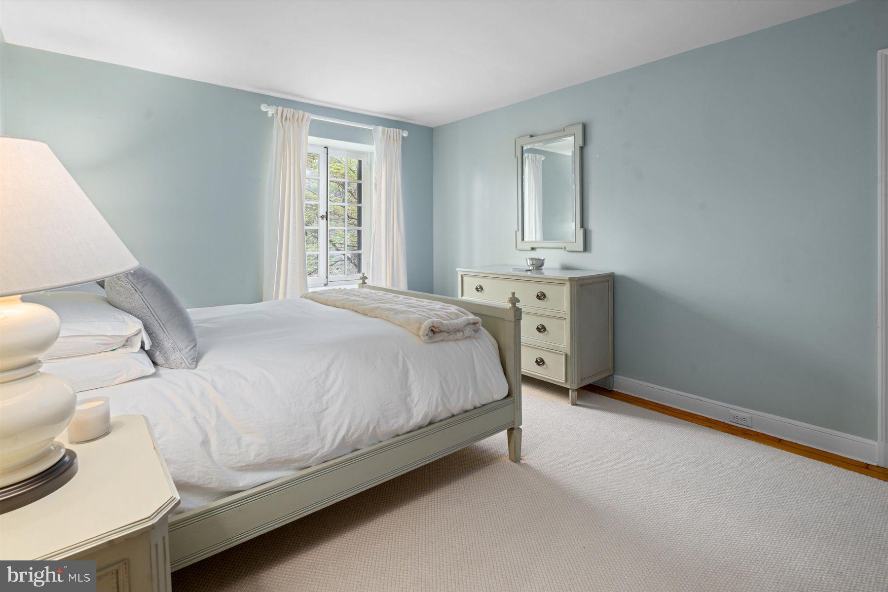 95 West Hampton Road Philadelphia, PA 19118 - Photo 28 of 37 a spacious bedroom with a bed and window
