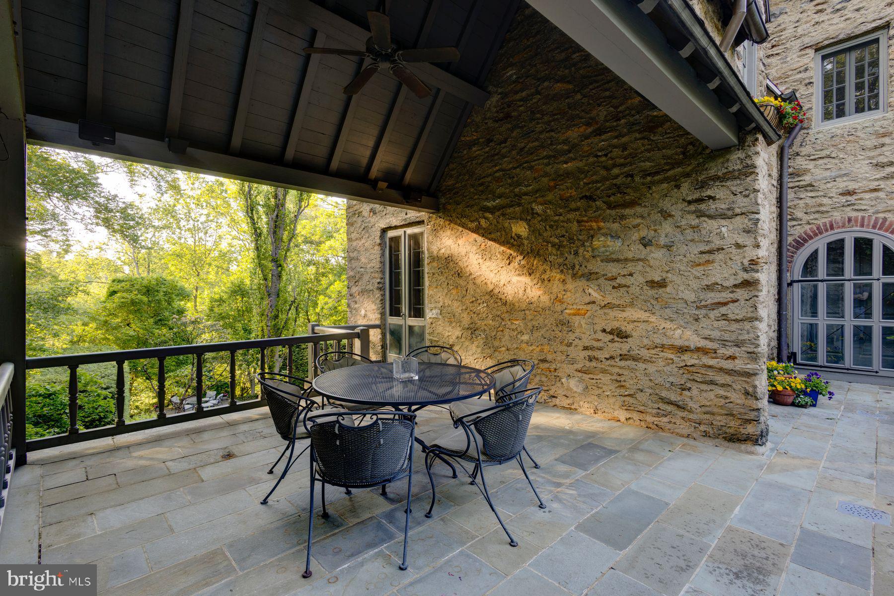 95 West Hampton Road Philadelphia, PA 19118 - Photo 35 of 37 a view of a patio with a table chairs and a table