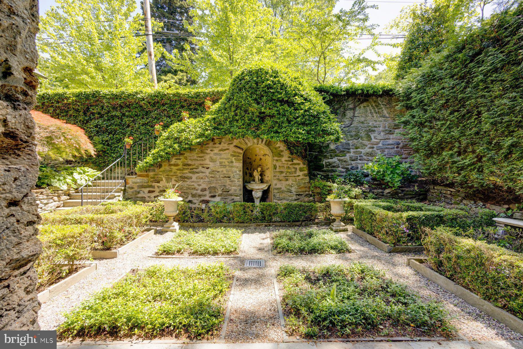 95 West Hampton Road Philadelphia, PA 19118 - Photo 6 of 37 a view of a yard with plants and large trees