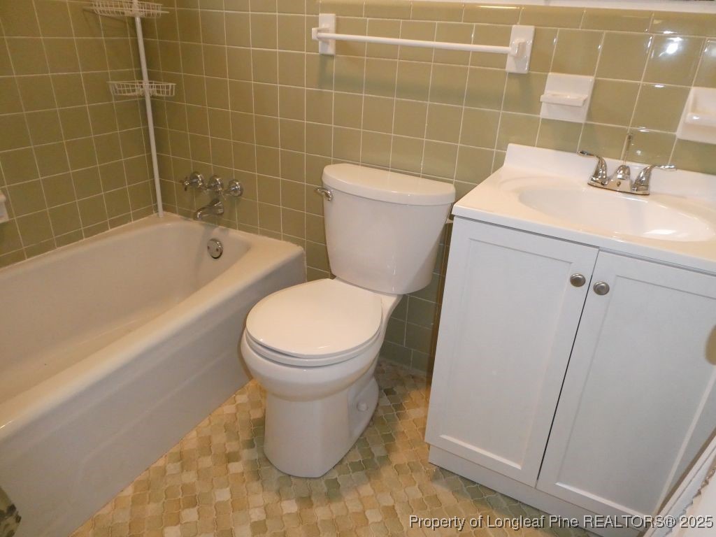 263 Forest Road Lumberton, NC 28358 - Photo 14 of 44 a bathroom with a sink toilet and shower