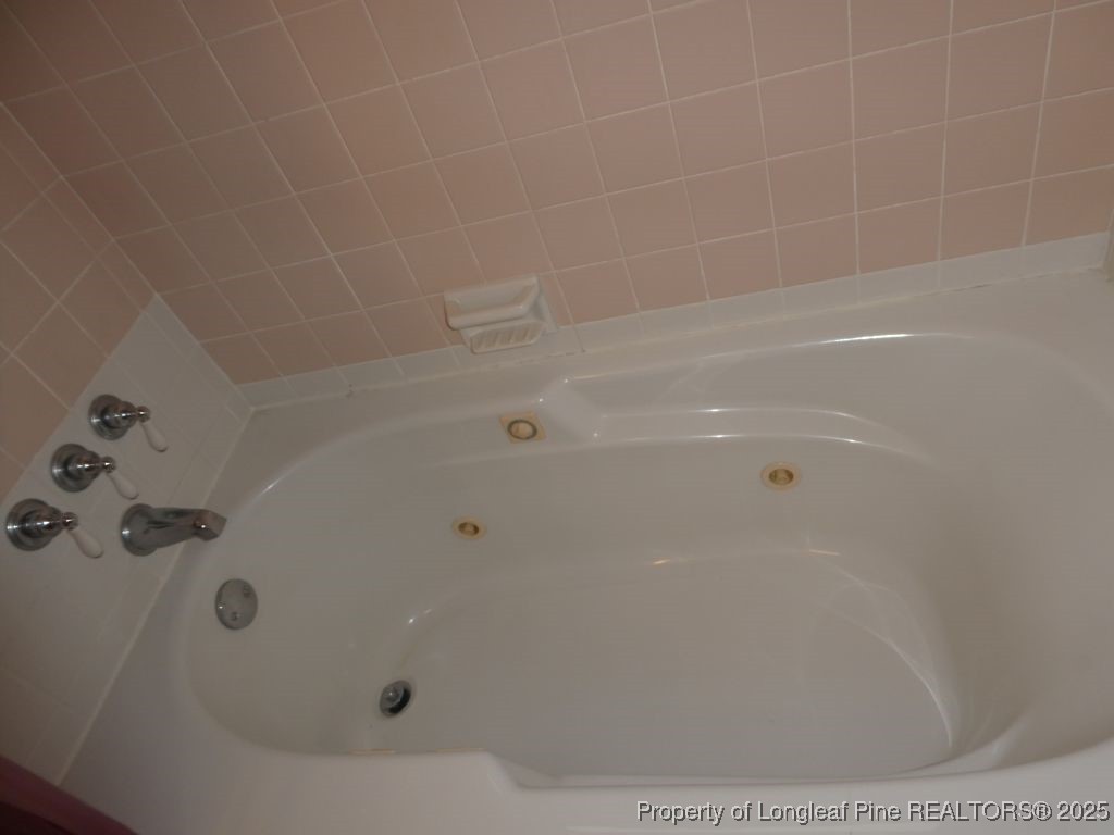263 Forest Road Lumberton, NC 28358 - Photo 18 of 44 a bathroom with a bathtub