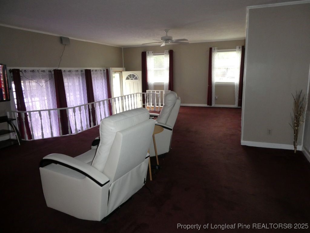 263 Forest Road Lumberton, NC 28358 - Photo 21 of 44 a living room with furniture and wooden floor