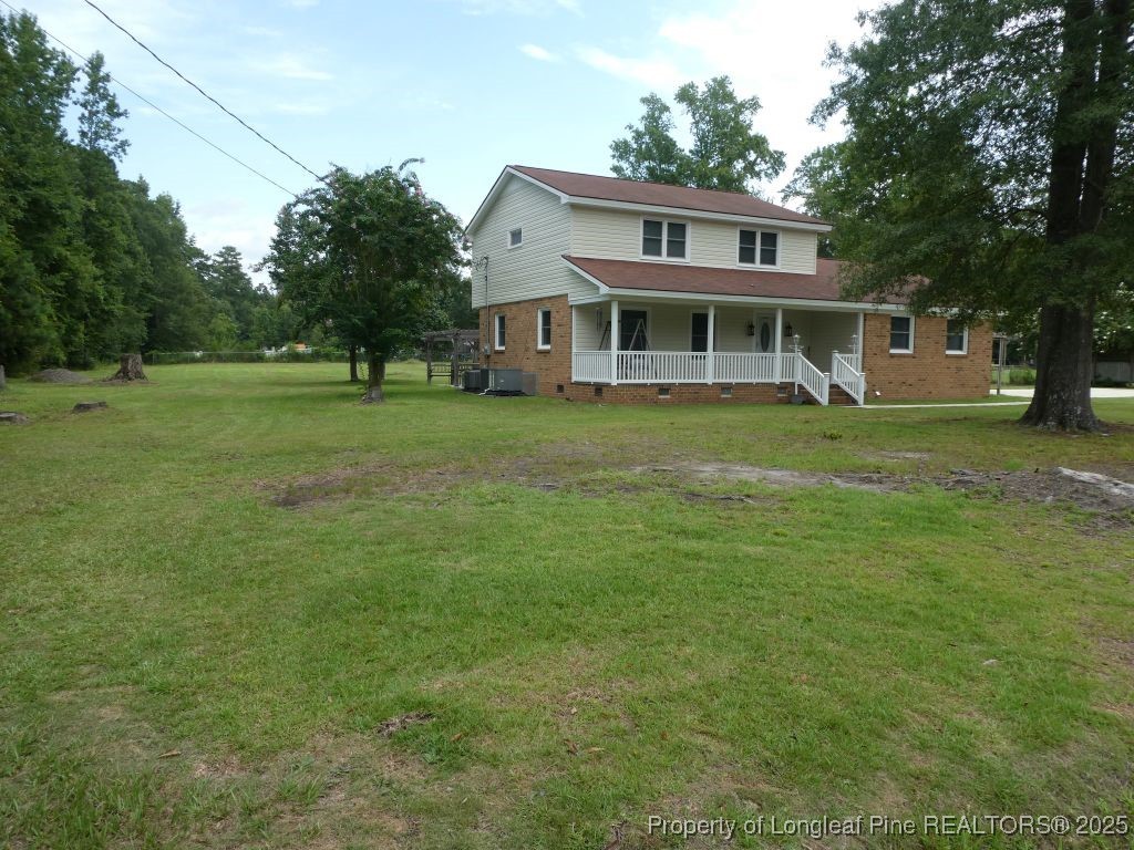 263 Forest Road Lumberton, NC 28358 - Photo 31 of 44 a front view of a house with a garden