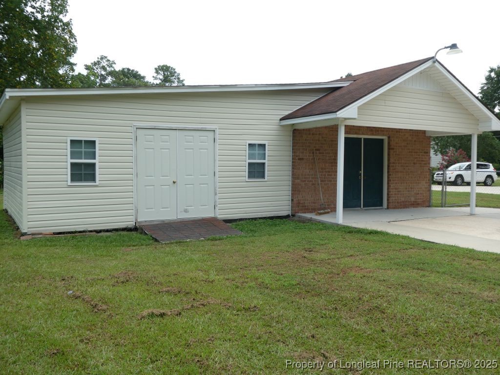 263 Forest Road Lumberton, NC 28358 - Photo 37 of 44 a view of a backyard with a garden