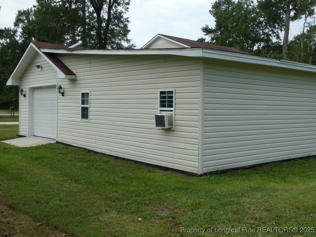 263 Forest Road Lumberton, NC 28358 - Photo 38 of 44 a view of a backyard with plants and a barbeque