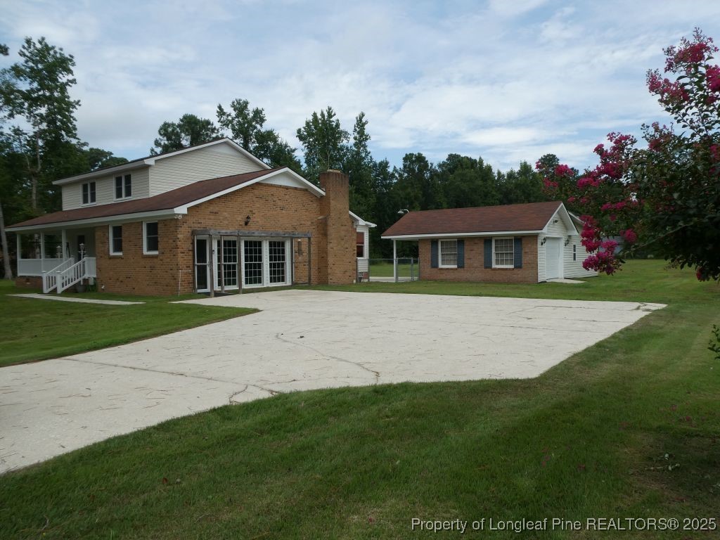 263 Forest Road Lumberton, NC 28358 - Photo 40 of 44 a front view of a house with a yard