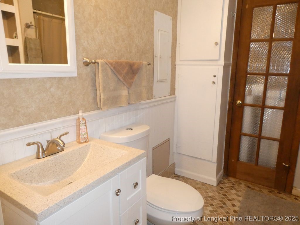 263 Forest Road Lumberton, NC 28358 - Photo 9 of 44 a bathroom with a sink toilet and shower