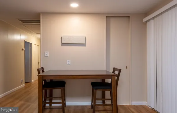 a view of a table and chairs in a kitchen