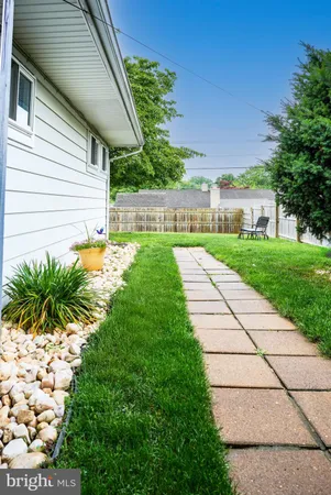 a view of a backyard with potted plants