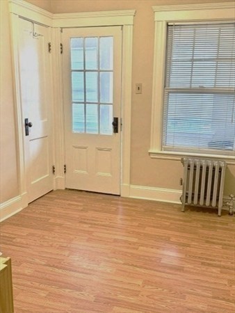 25 Glendower Road, Unit 2 Boston, MA 02131 - Photo 15 of 17 a view of an empty room with wooden floor and a window