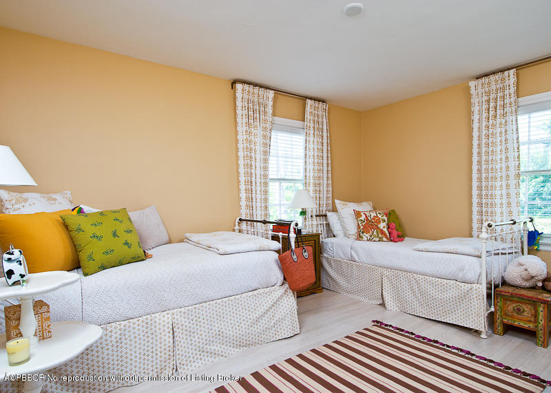 266 Monterey Road Palm Beach, FL 33480 - Photo 11 of 16 a bedroom with a bed and wooden floor