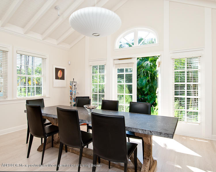 266 Monterey Road Palm Beach, FL 33480 - Photo 5 of 16 a view of a dining room with furniture large windows and wooden floor