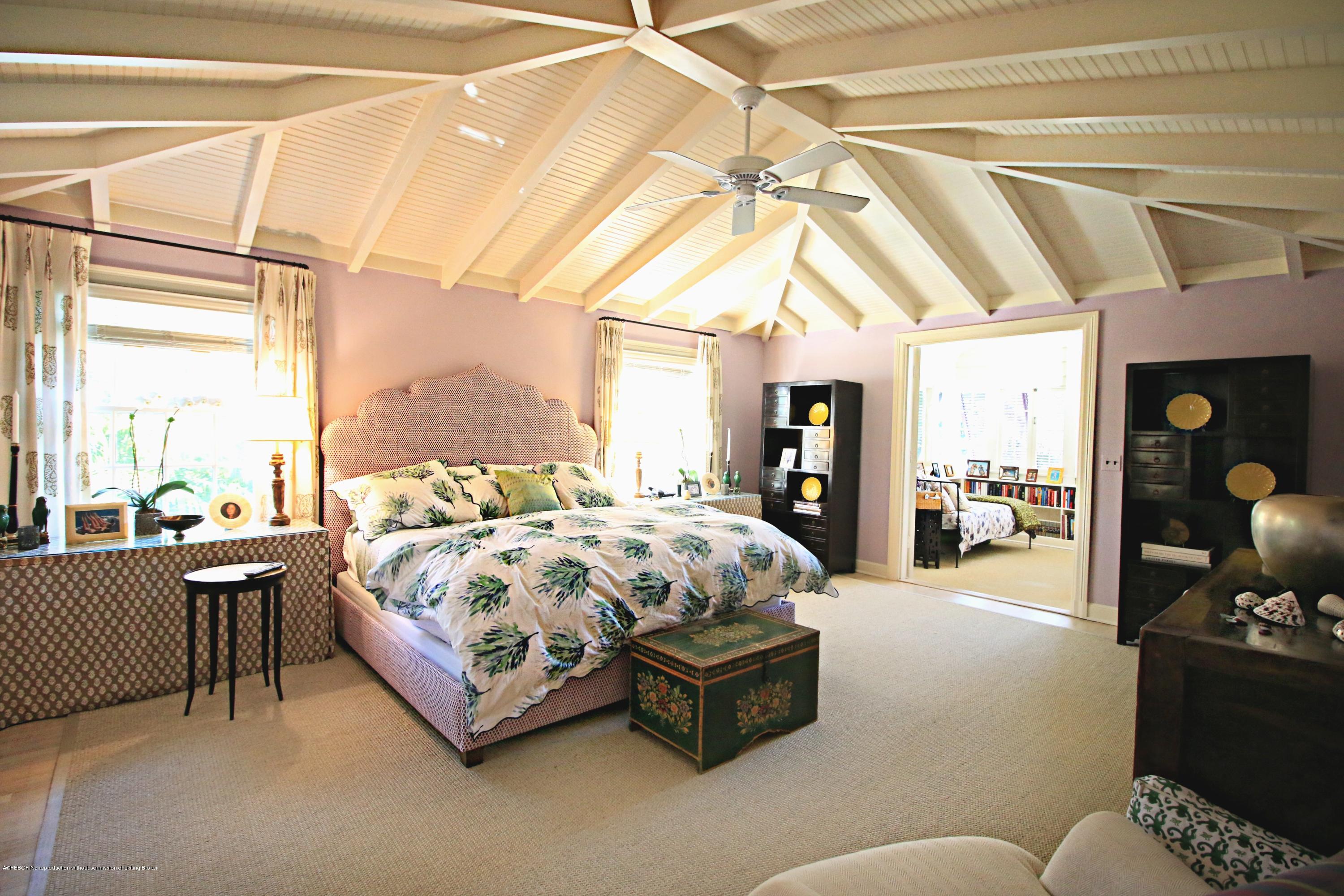 266 Monterey Road Palm Beach, FL 33480 - Photo 7 of 16 a bed sitting in a bedroom next to a window