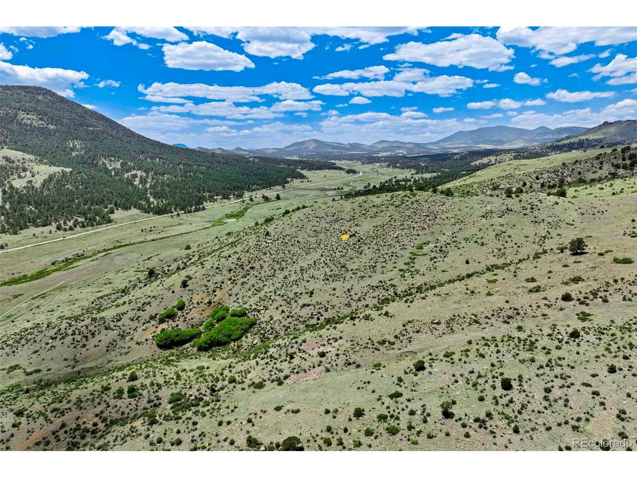 3 County Road 102 Guffey, CO 80820 - Photo 8 of 16 a view of a yard with an ocean
