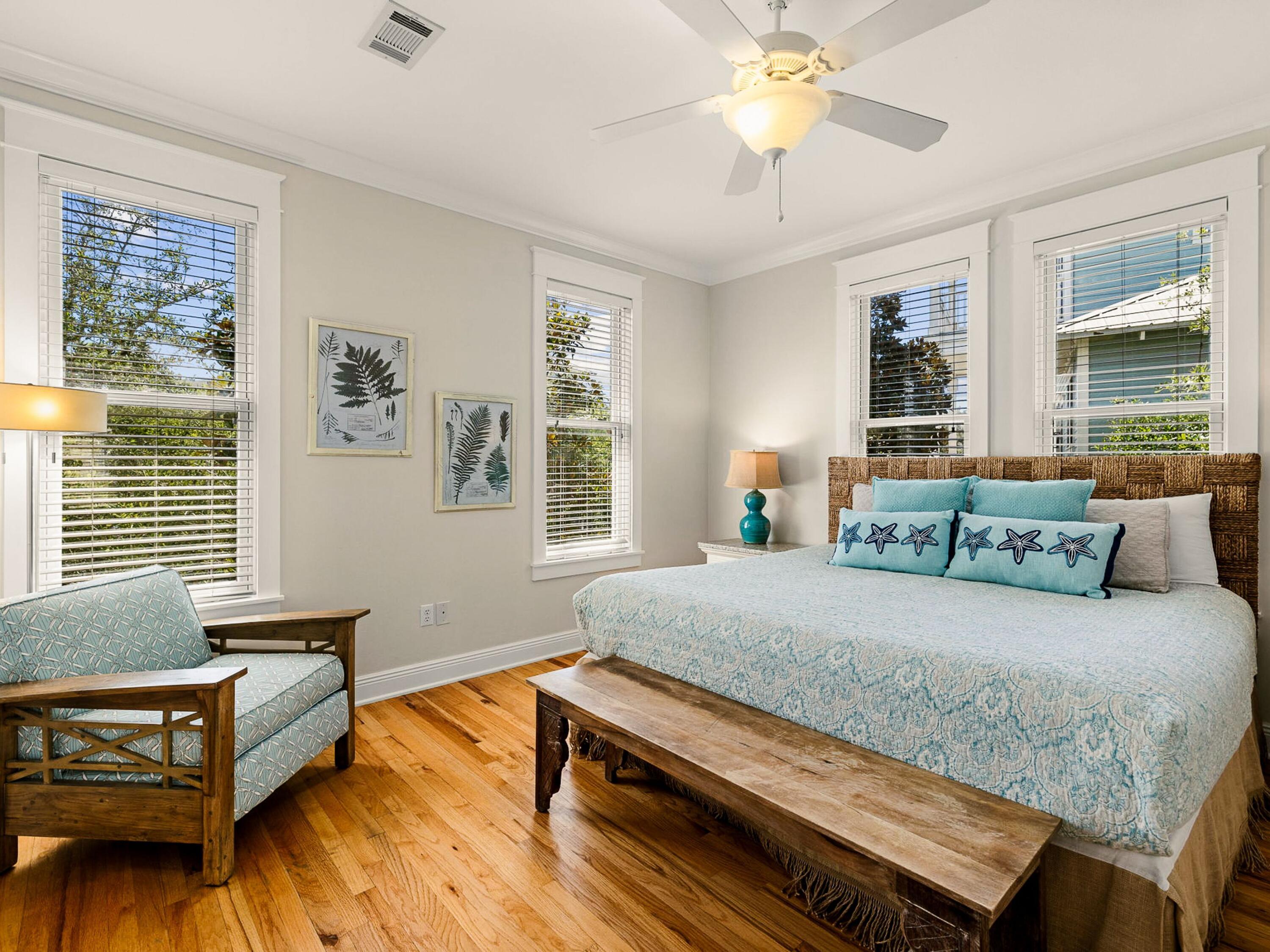 107 Chelsea Loop Road Santa Rosa Beach, FL 32459 - Photo 14 of 28 a bedroom with a bed and wooden floor