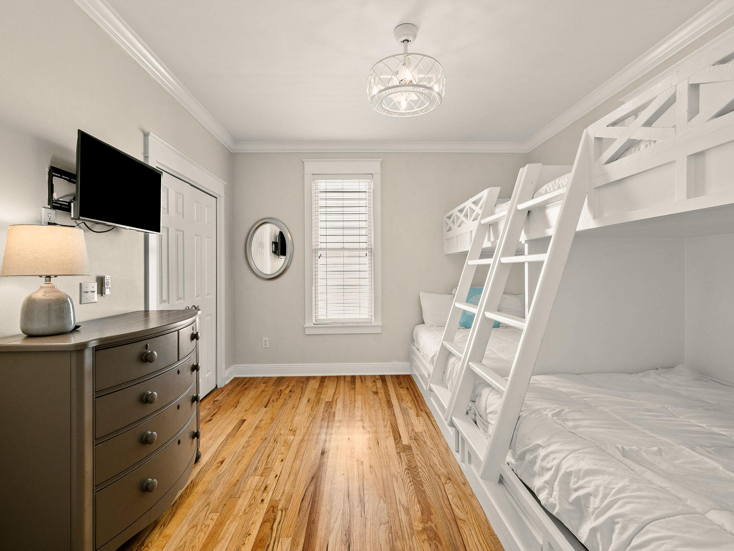 107 Chelsea Loop Road Santa Rosa Beach, FL 32459 - Photo 16 of 28 a view of a livingroom with wooden floor and kitchen space