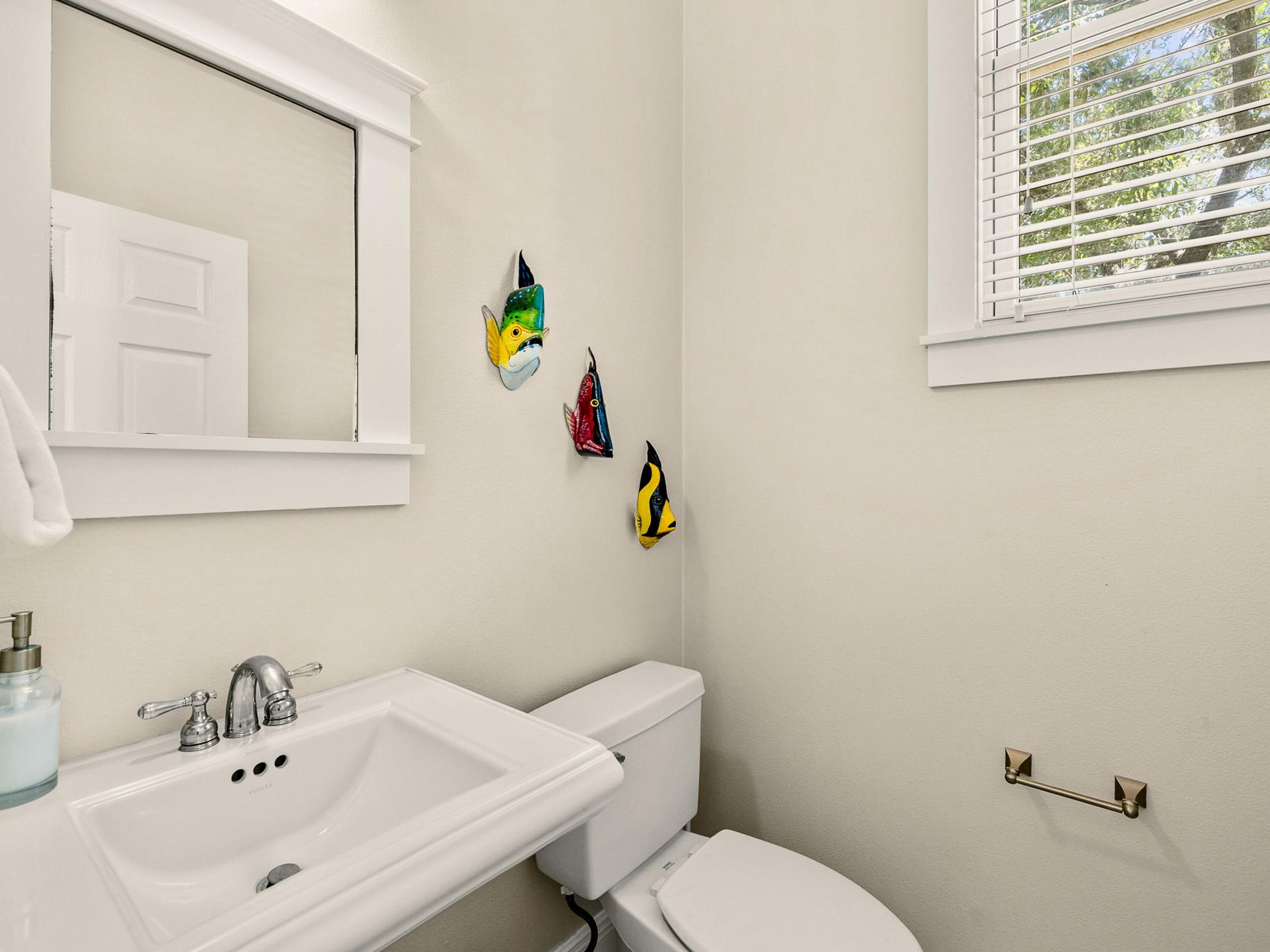 107 Chelsea Loop Road Santa Rosa Beach, FL 32459 - Photo 17 of 28 a bathroom with a sink mirror and toilet