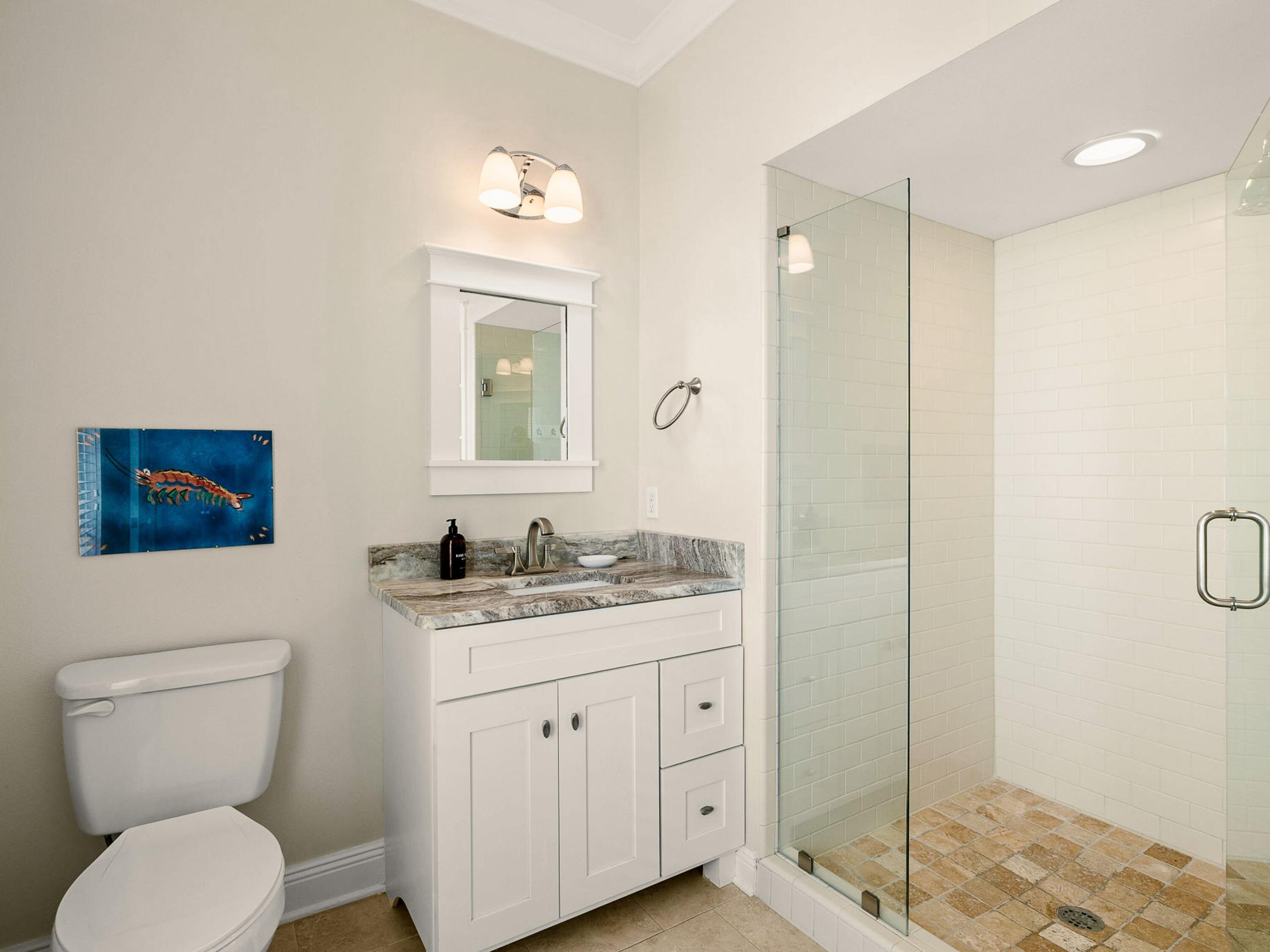 107 Chelsea Loop Road Santa Rosa Beach, FL 32459 - Photo 19 of 28 a bathroom with a toilet a sink and mirror