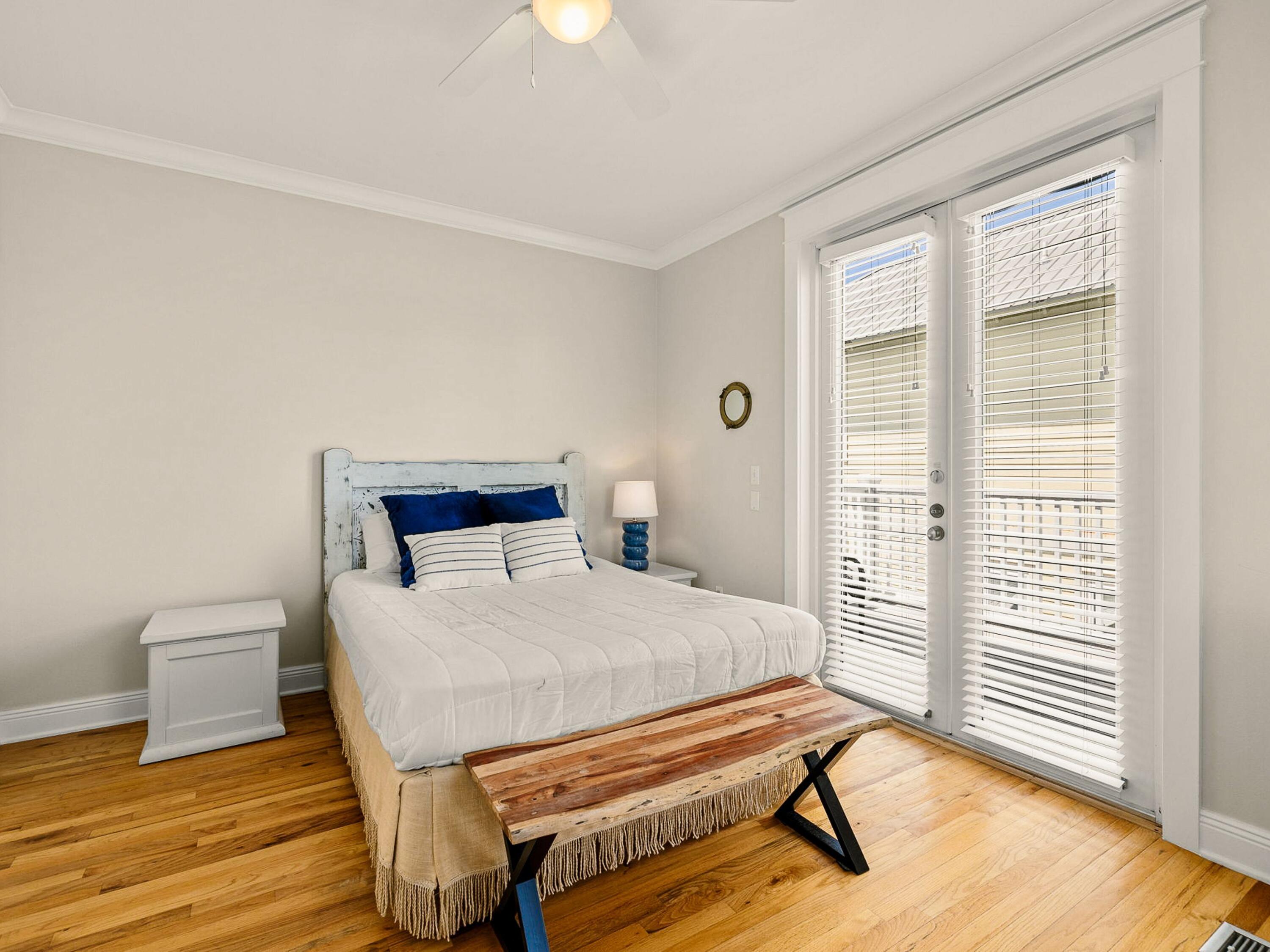 107 Chelsea Loop Road Santa Rosa Beach, FL 32459 - Photo 22 of 28 a bedroom with a bed and wooden floor