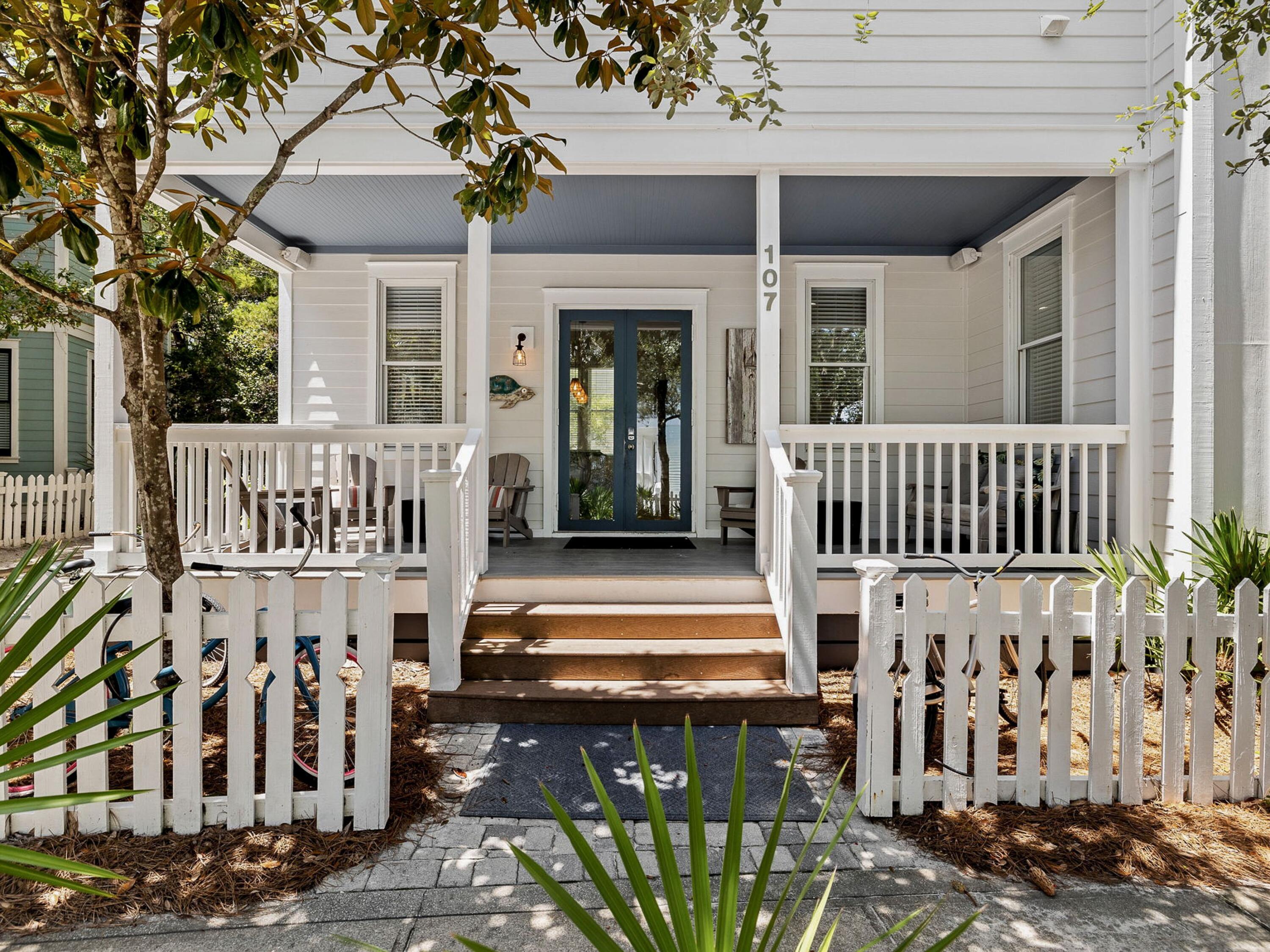107 Chelsea Loop Road Santa Rosa Beach, FL 32459 - Photo 9 of 28 a view of a patio with a table and chairs