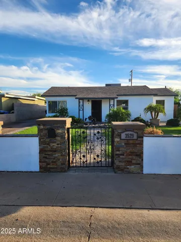 a view of a patio with table and chairs