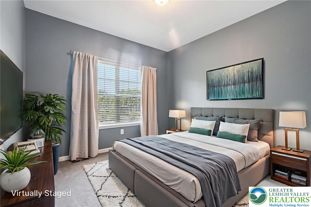 3334 Coventry Drive Lower Macungie Township, PA 18062 - Photo 16 of 51 a bedroom with bed and potted plant