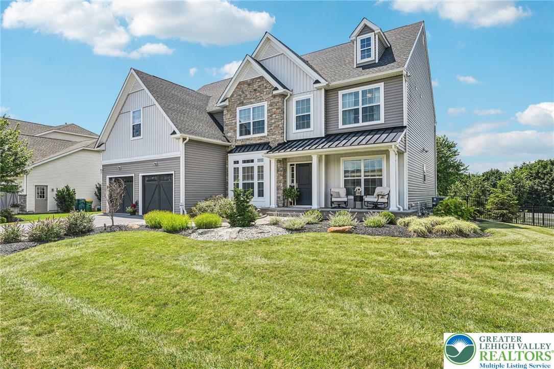 3334 Coventry Drive Lower Macungie Township, PA 18062 - Photo 3 of 51 a front view of a house with swimming pool and porch