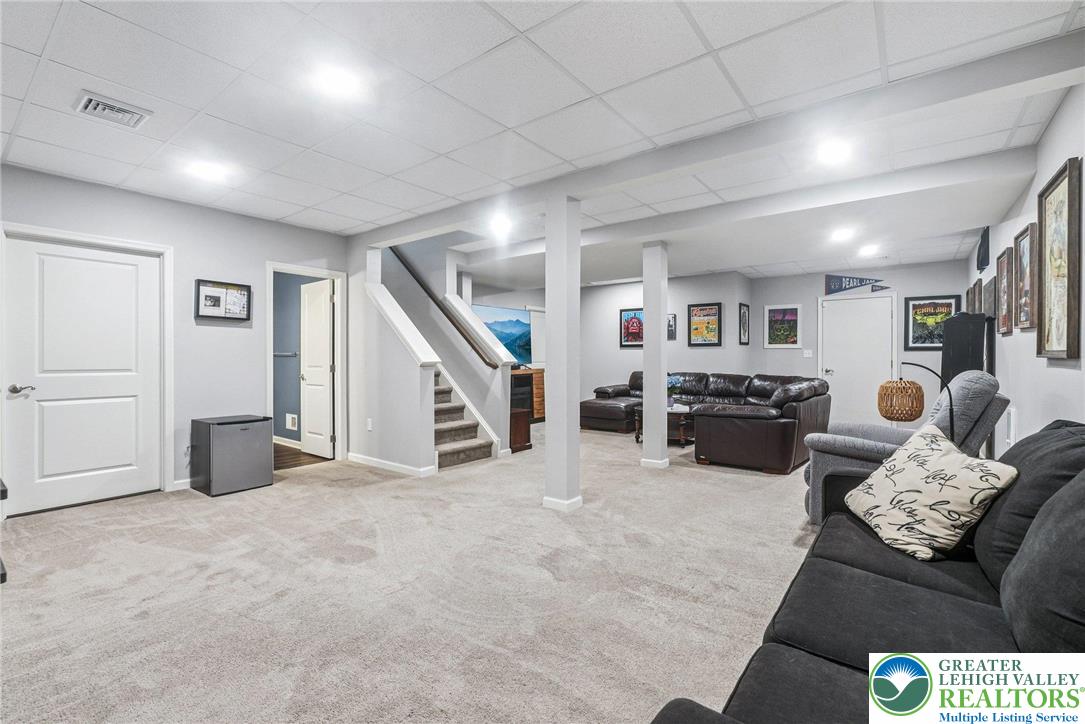 3334 Coventry Drive Lower Macungie Township, PA 18062 - Photo 40 of 51 a living room with furniture and a flat screen tv