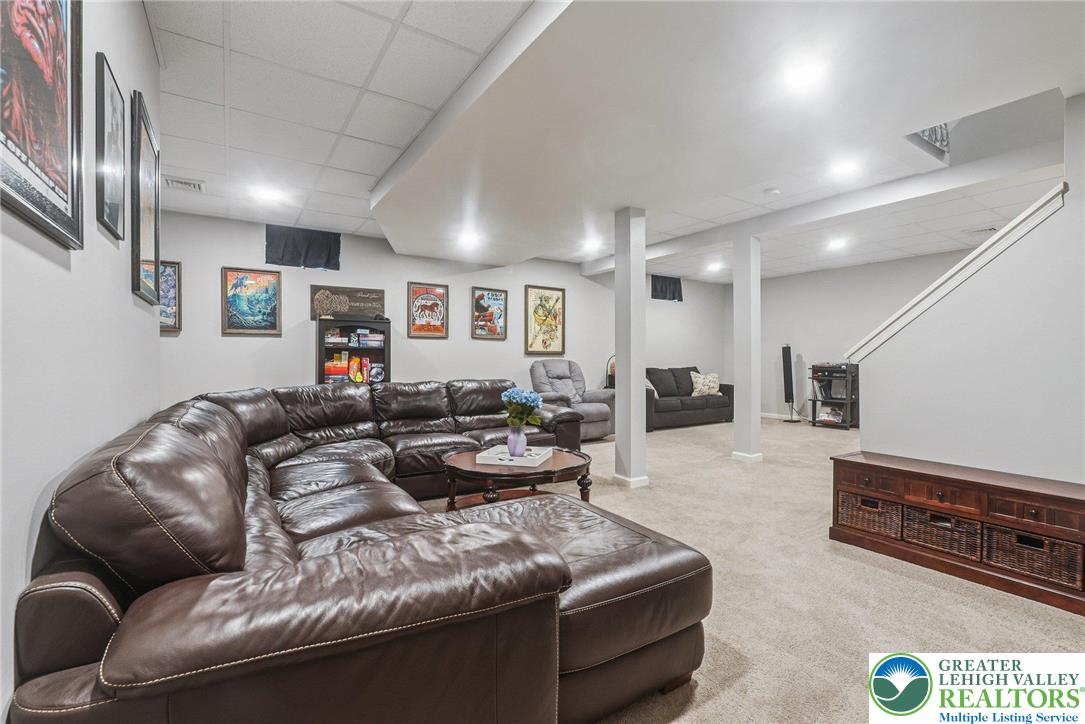 3334 Coventry Drive Lower Macungie Township, PA 18062 - Photo 41 of 51 a living room with furniture and a flat screen tv