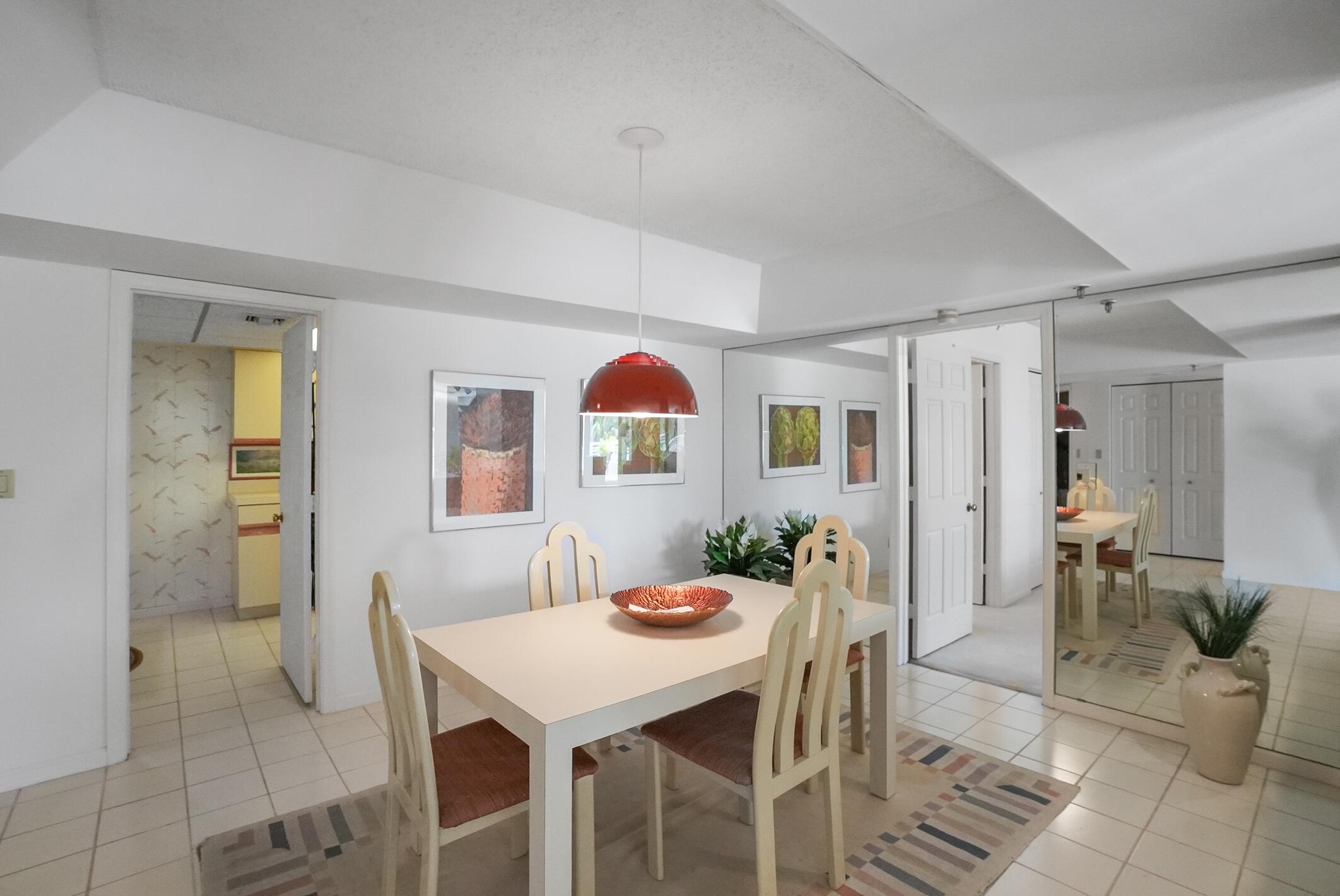 176 Helios Drive, Unit 102 Jupiter, FL 33477 - Photo 11 of 25 a view of a dining room with furniture