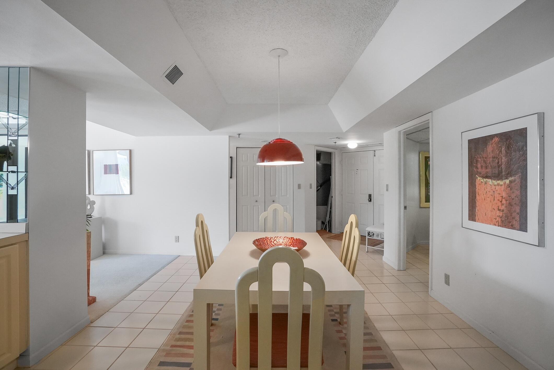 176 Helios Drive, Unit 102 Jupiter, FL 33477 - Photo 12 of 25 a view of a livingroom with furniture and entryway