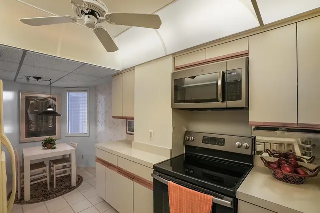 a kitchen with a stove and a microwave