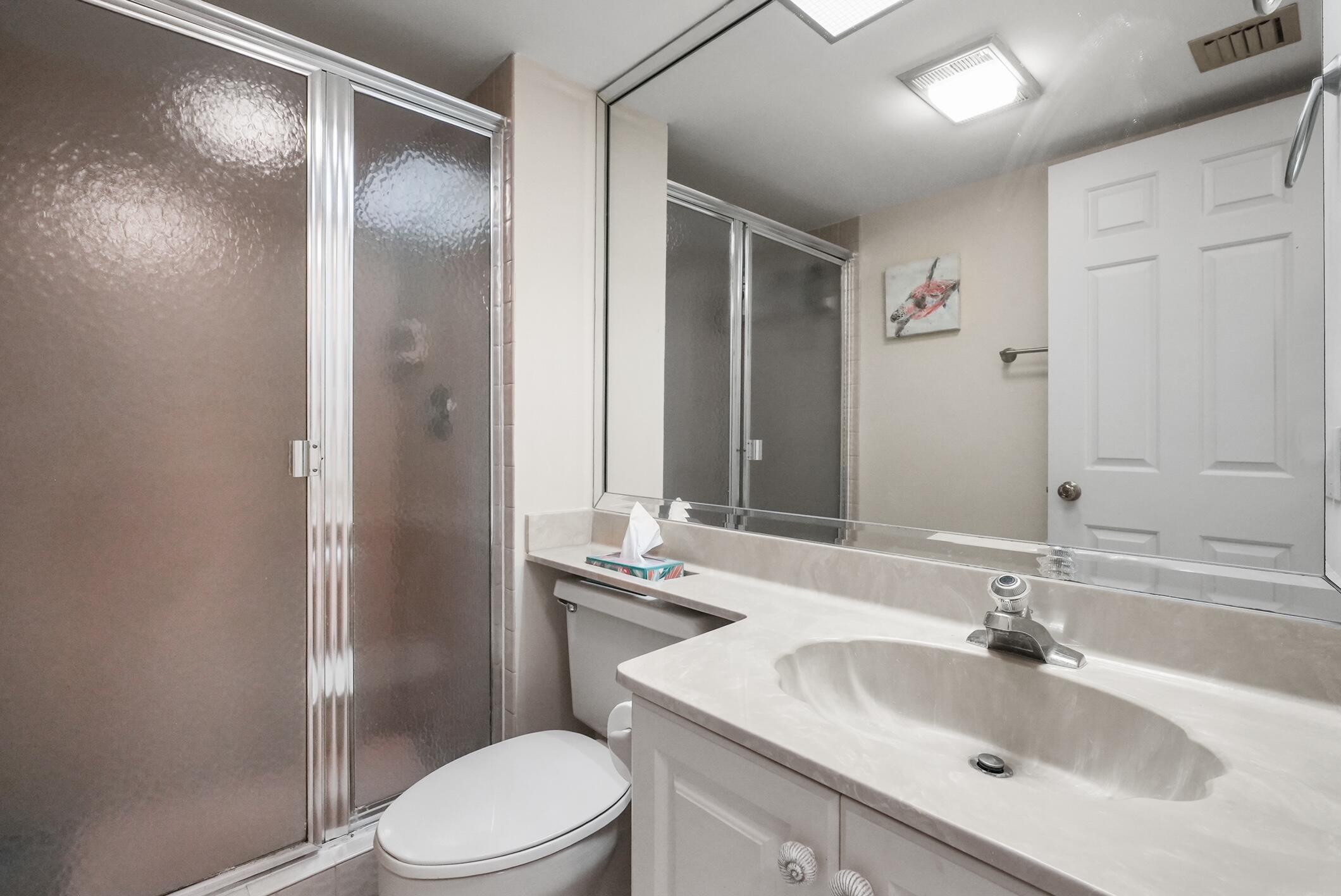 176 Helios Drive, Unit 102 Jupiter, FL 33477 - Photo 19 of 25 a bathroom with a sink toilet and shower