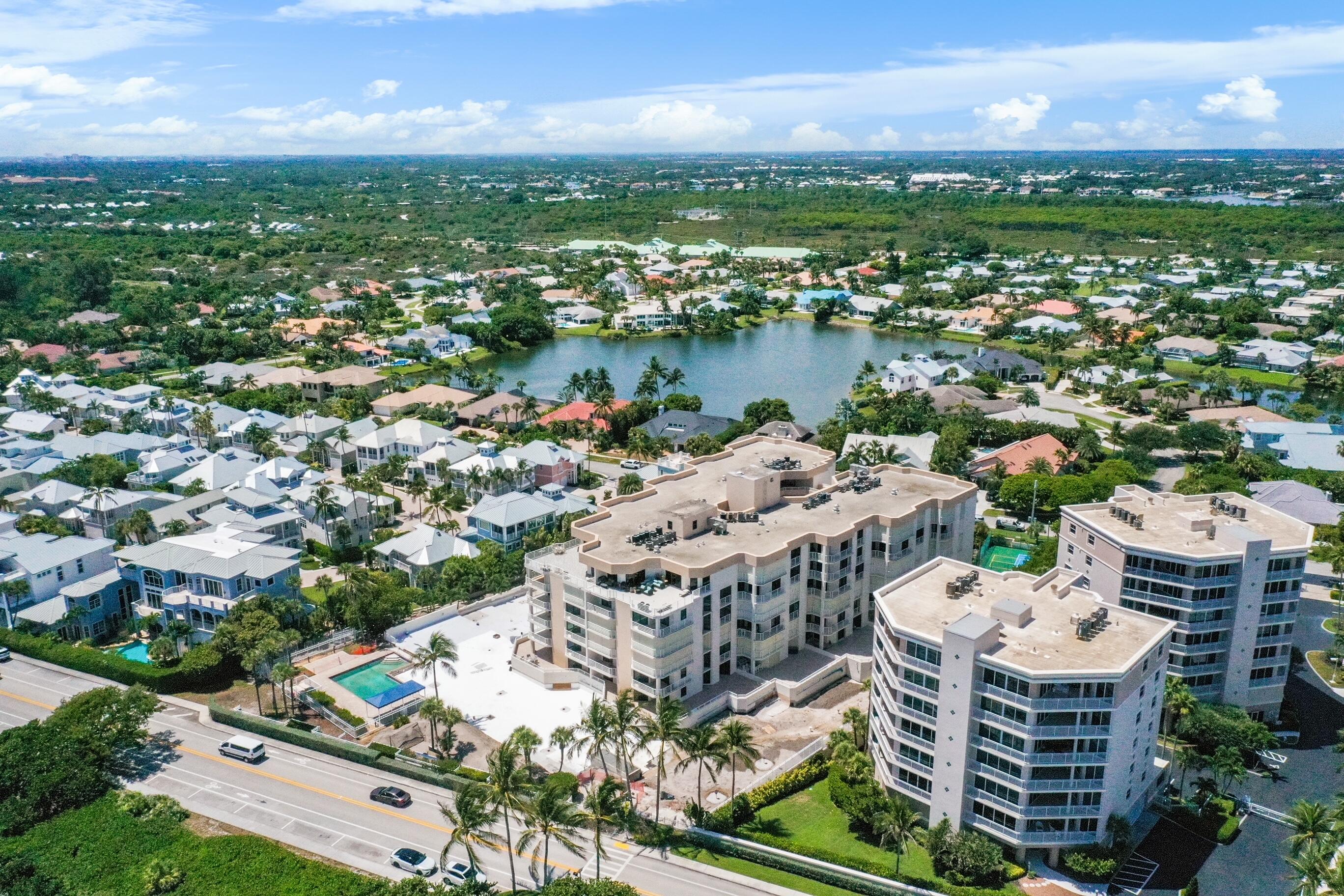 176 Helios Drive, Unit 102 Jupiter, FL 33477 - Photo 5 of 25 a picture of city view with lake view