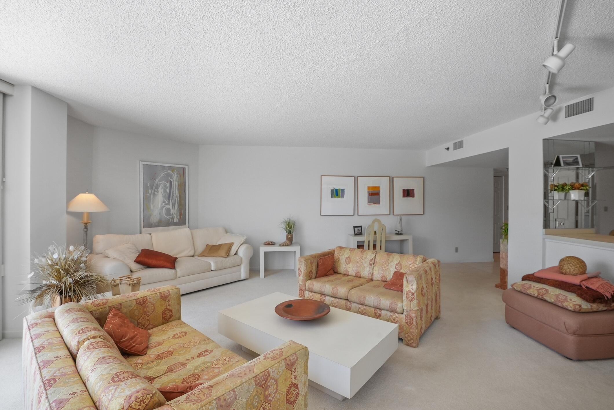 176 Helios Drive, Unit 102 Jupiter, FL 33477 - Photo 7 of 25 a living room with furniture and wooden floor