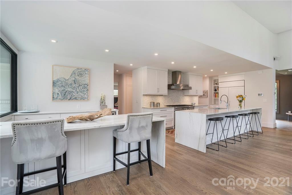 5201 Addison Drive Charlotte, NC 28211 - Photo 16 of 48 a kitchen with a sink cabinets and wooden floor