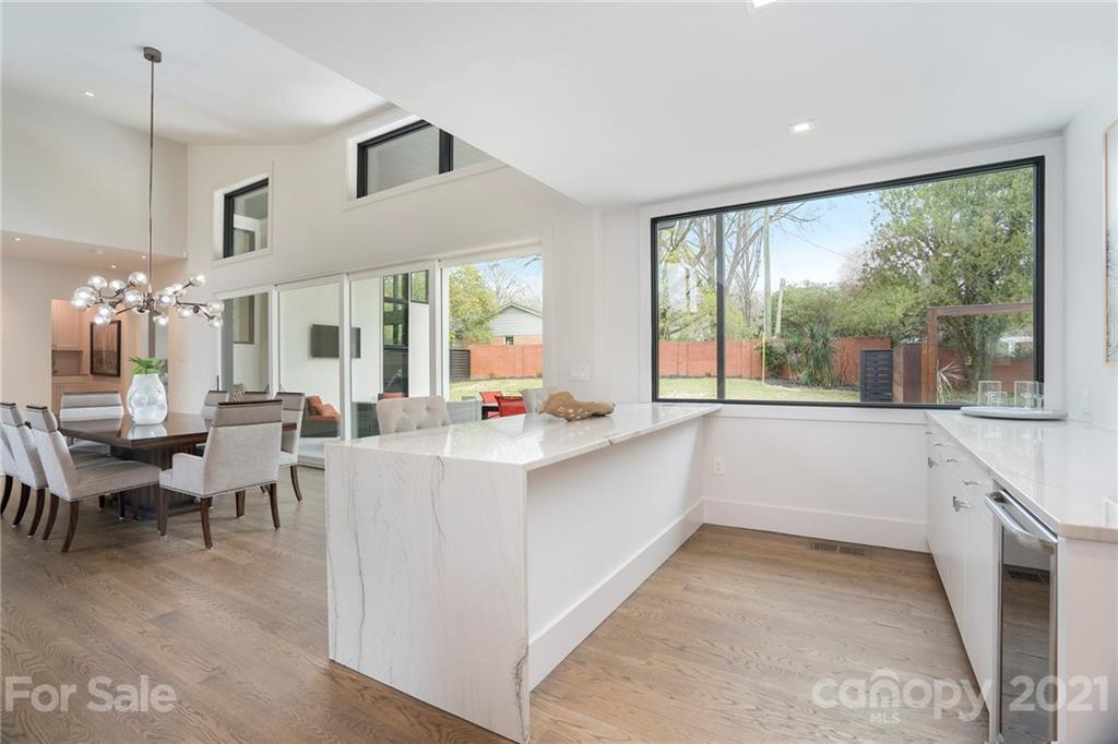 5201 Addison Drive Charlotte, NC 28211 - Photo 17 of 48 a large white kitchen with a large window