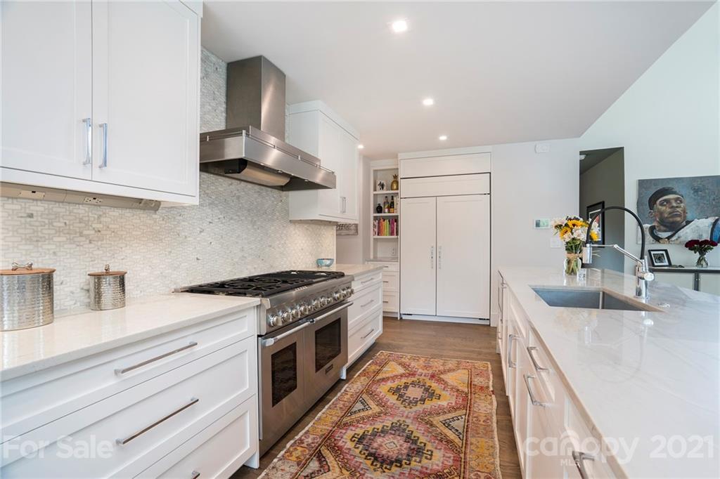 5201 Addison Drive Charlotte, NC 28211 - Photo 18 of 48 a kitchen with stainless steel appliances granite countertop a sink stove and refrigerator