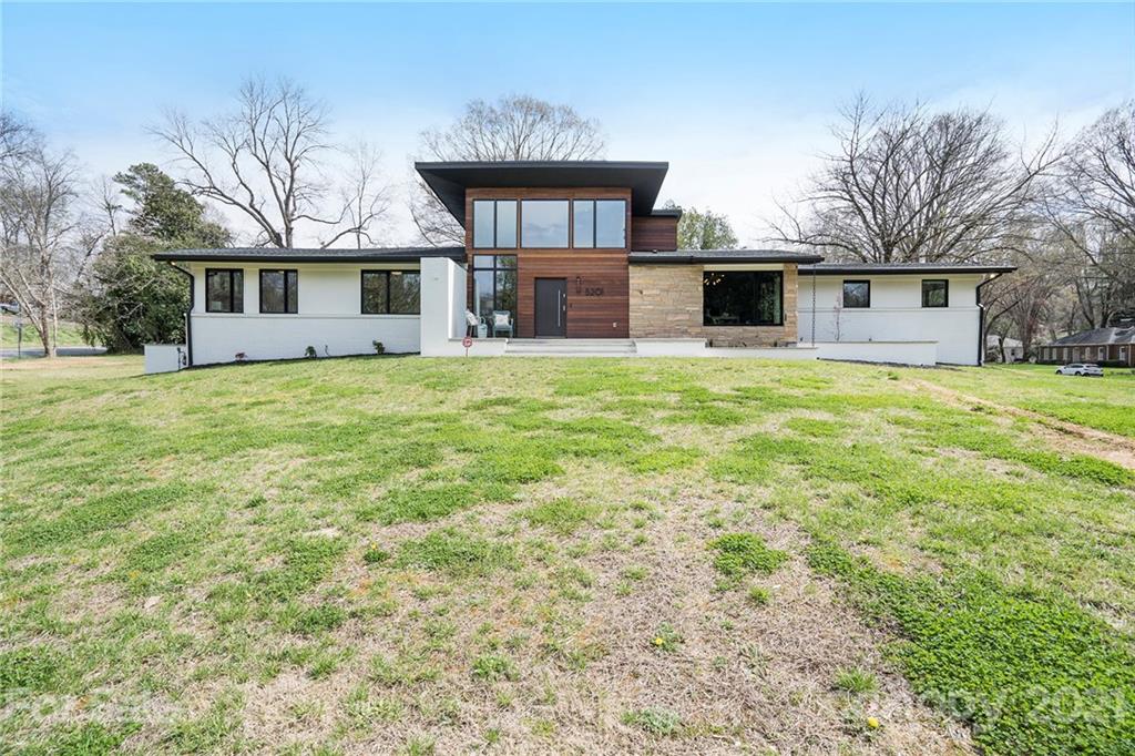 5201 Addison Drive Charlotte, NC 28211 - Photo 3 of 48 a house that has a big yard in front of it