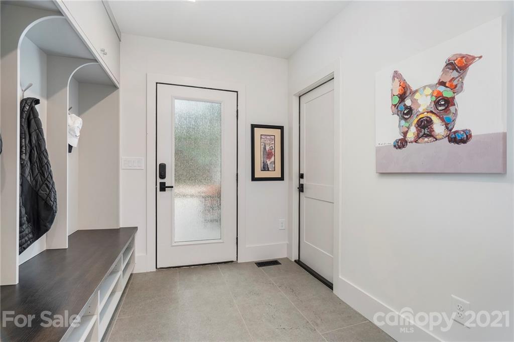 5201 Addison Drive Charlotte, NC 28211 - Photo 21 of 48 a view of a hallway with a painting on the wall