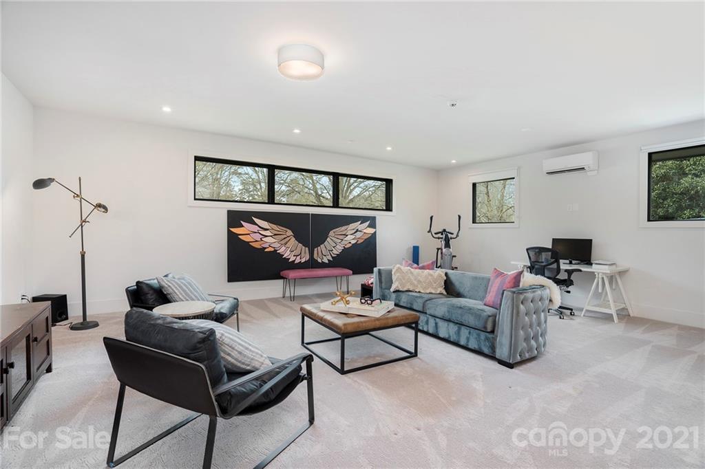 5201 Addison Drive Charlotte, NC 28211 - Photo 22 of 48 a living room with furniture and a rug