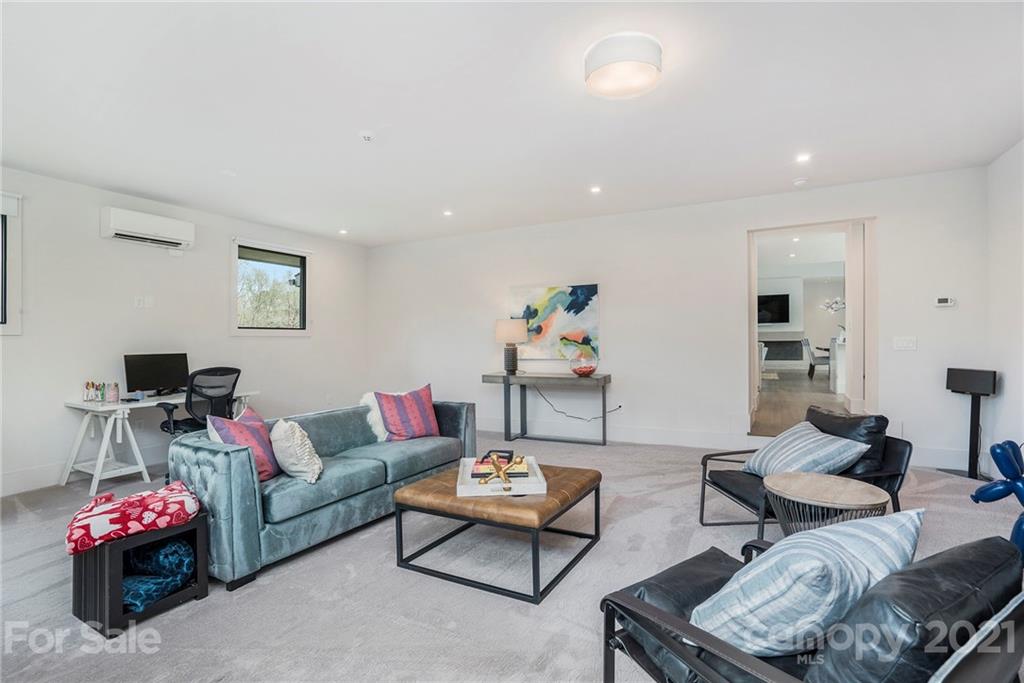 5201 Addison Drive Charlotte, NC 28211 - Photo 23 of 48 a living room with furniture and a flat screen tv