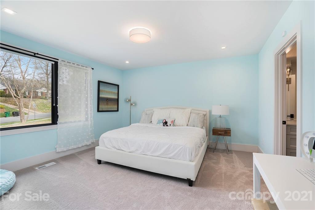 5201 Addison Drive Charlotte, NC 28211 - Photo 31 of 48 a bedroom with a large bed and a window